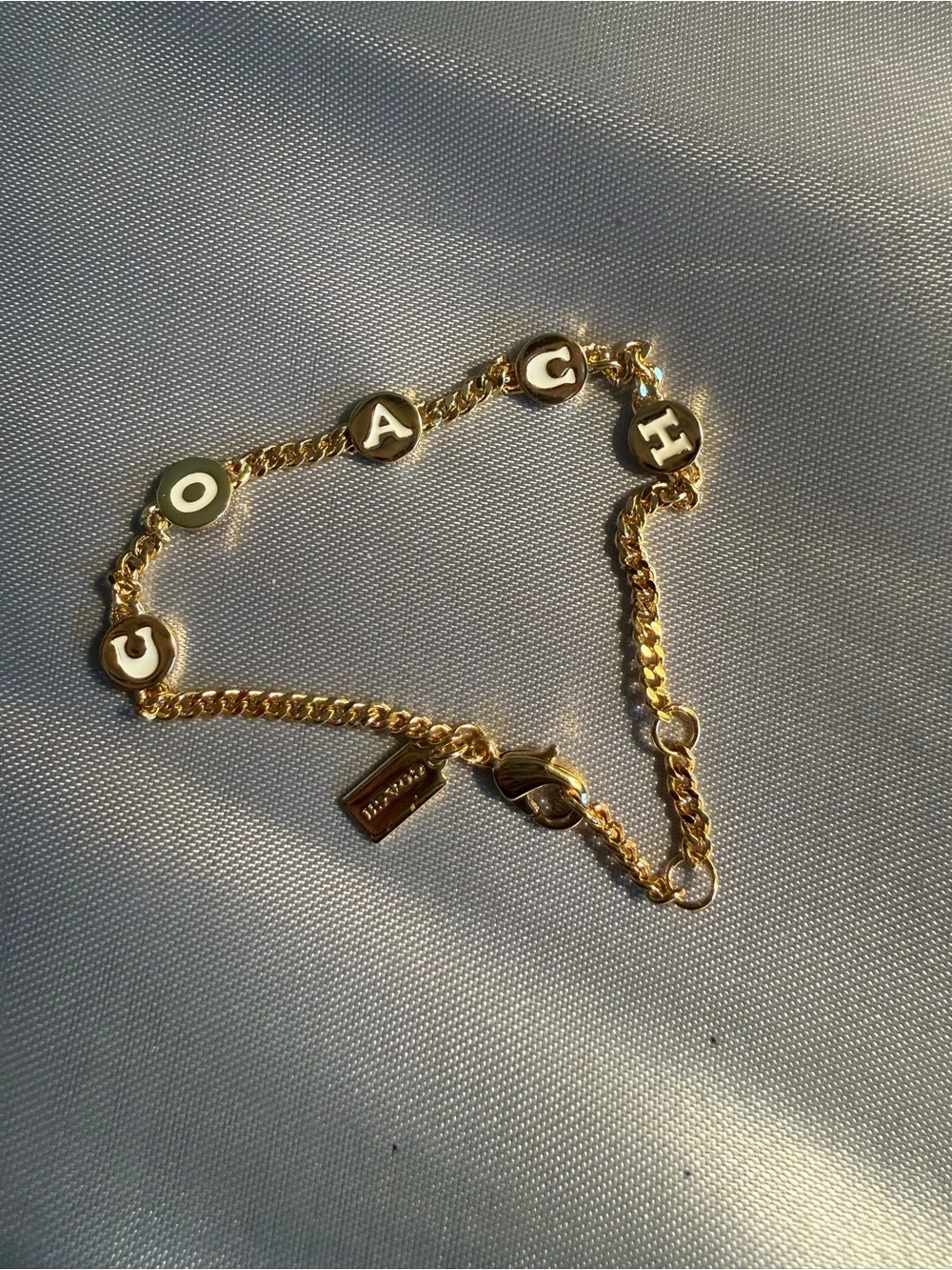 Coach Gold-Tone Letter Disc Chain Bracelet with White Enamel